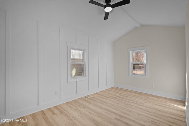 bonus room with ceiling fan, light hardwood / wood-style flooring, and vaulted ceiling with beams