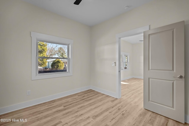 unfurnished room featuring ceiling fan and light wood-type flooring