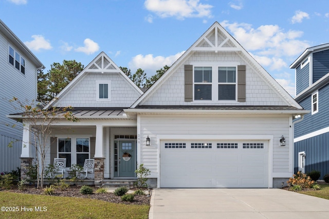 craftsman house with a garage and covered porch