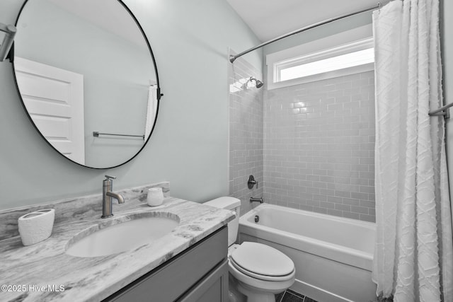 full bathroom featuring shower / bath combination with curtain, vanity, and toilet