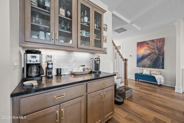 bar featuring tasteful backsplash, dark wood-type flooring, wooden ceiling, and beam ceiling