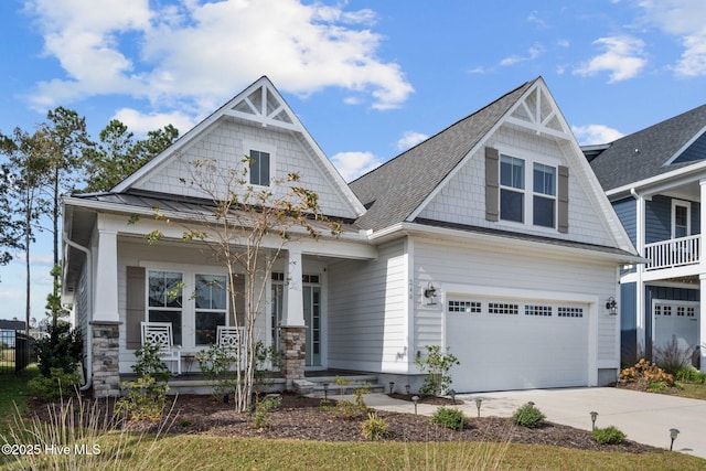 craftsman-style house with a garage and covered porch