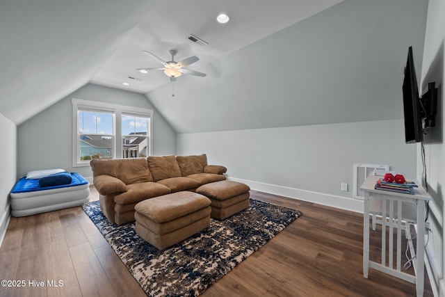 living room featuring dark wood-type flooring, ceiling fan, and lofted ceiling