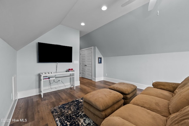 living room featuring ceiling fan, lofted ceiling, and dark hardwood / wood-style flooring