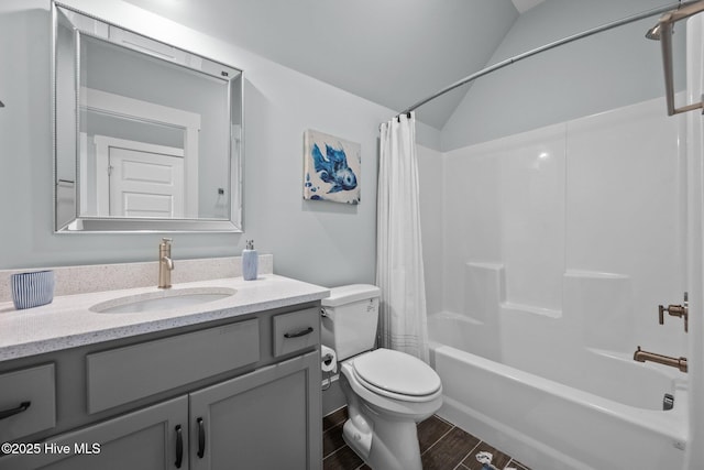 full bathroom with vanity, toilet, vaulted ceiling, and shower / bath combo