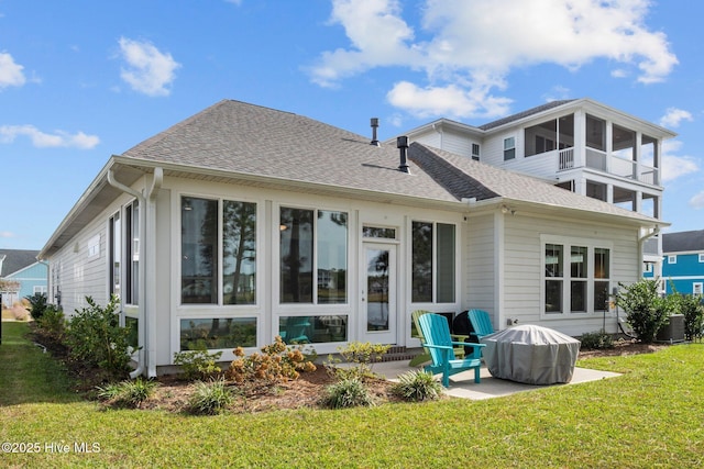 back of house featuring cooling unit, a lawn, and a patio