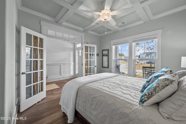 bedroom with beamed ceiling, coffered ceiling, dark hardwood / wood-style flooring, and french doors