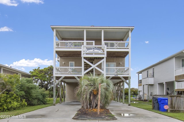 coastal home with a carport and a balcony