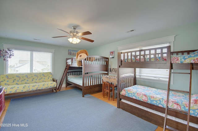 bedroom featuring hardwood / wood-style floors and ceiling fan