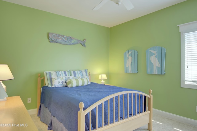 bedroom featuring light carpet and ceiling fan