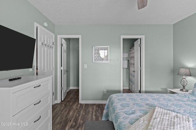 bedroom with dark hardwood / wood-style flooring and a textured ceiling