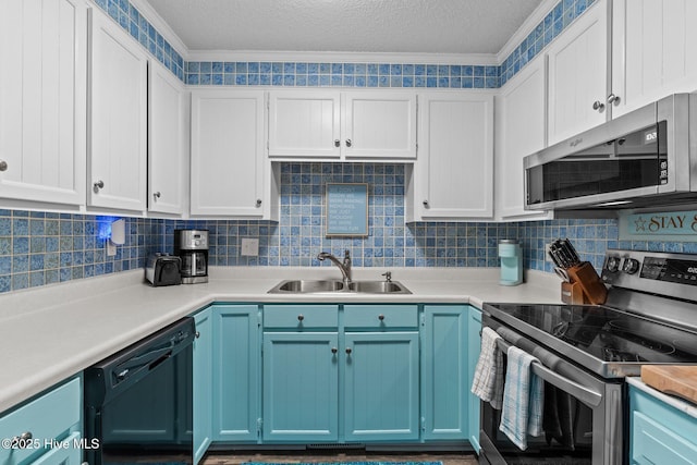 kitchen featuring stainless steel appliances, tasteful backsplash, sink, and blue cabinets