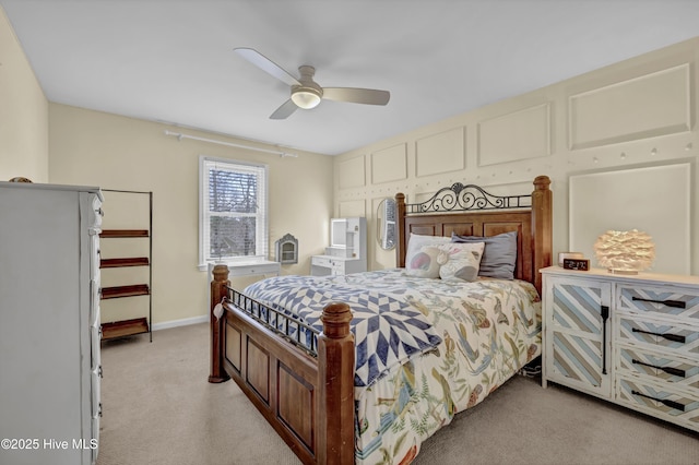 bedroom with light colored carpet and ceiling fan