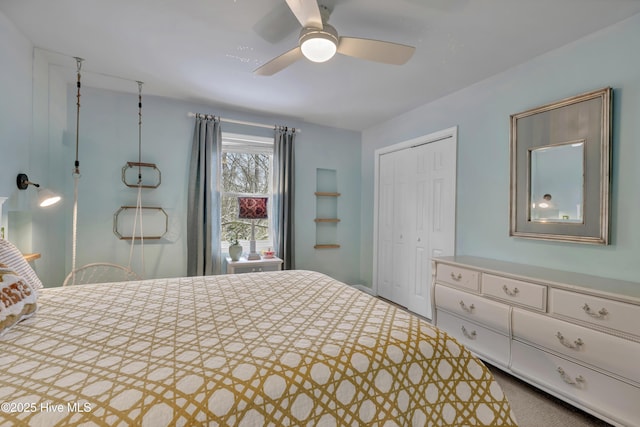 carpeted bedroom featuring a closet and ceiling fan