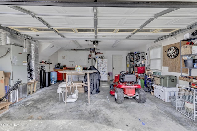 garage featuring a garage door opener and a workshop area