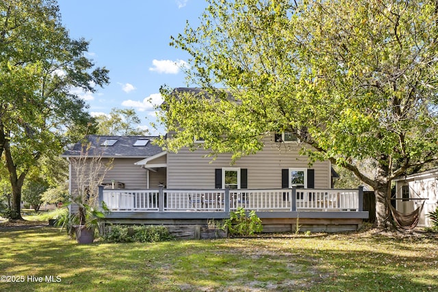 back of house with a yard and a wooden deck