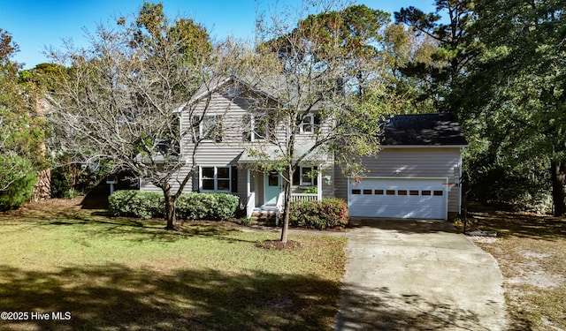 view of property with a front yard and a garage