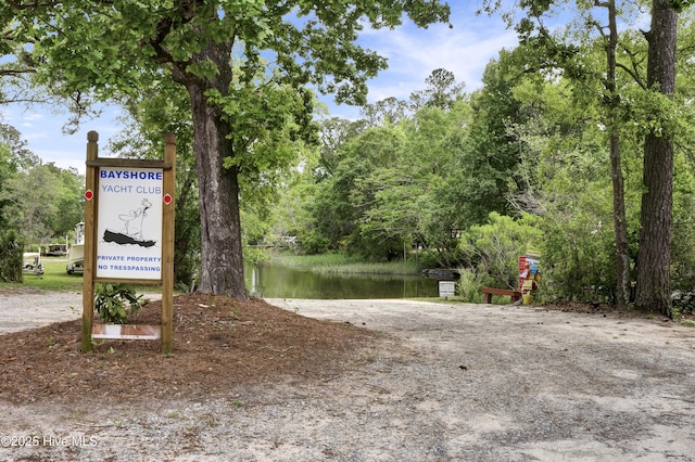 surrounding community with a water view