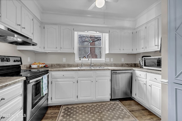 kitchen featuring stainless steel appliances, white cabinets, and sink