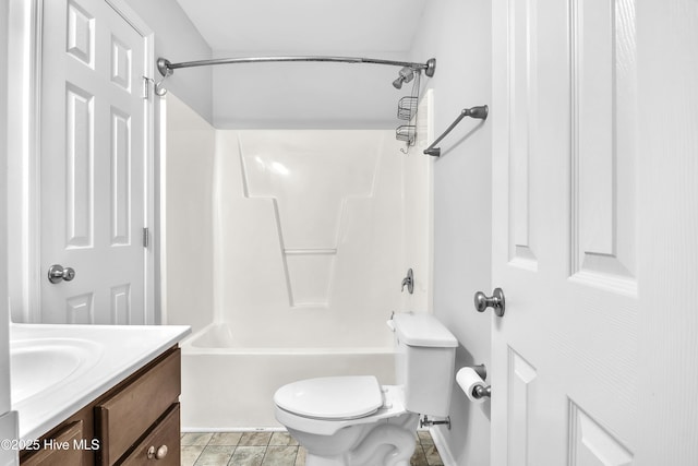 full bathroom featuring washtub / shower combination, vanity, toilet, and tile patterned flooring