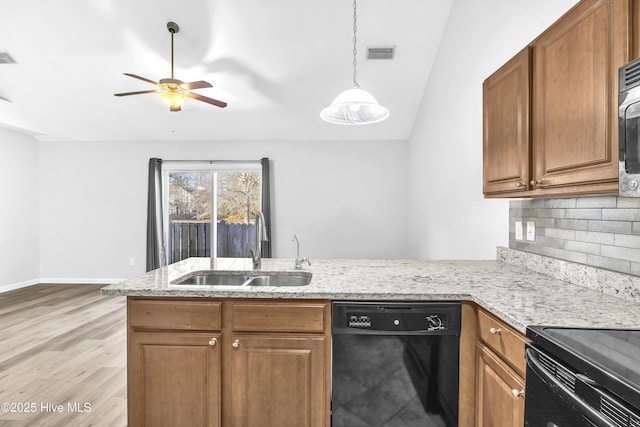 kitchen with sink, light hardwood / wood-style flooring, black dishwasher, decorative backsplash, and kitchen peninsula