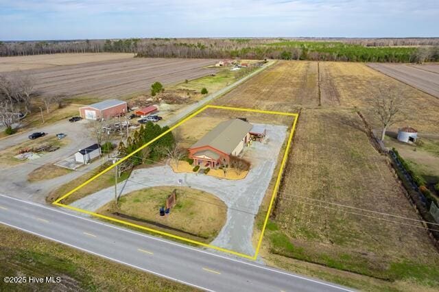 birds eye view of property with a rural view