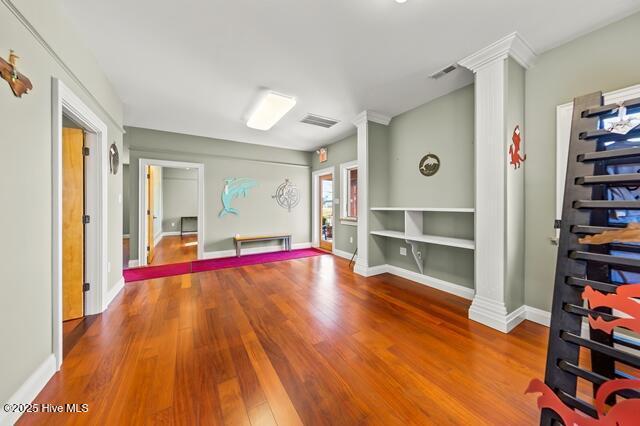 22327 NC Highway 55, Oriental, NC 28571 - interior space featuring hardwood / wood-style flooring and ornate columns