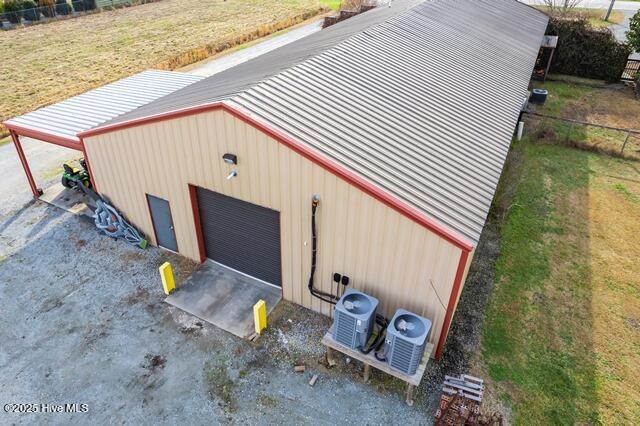22327 NC Highway 55, Oriental, NC 28571 - garage with central AC unit and a lawn
