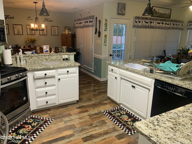 kitchen with white cabinetry, stainless steel appliances, light stone countertops, and pendant lighting