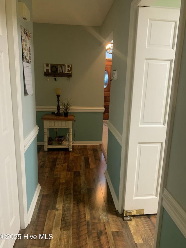 hallway with dark wood-type flooring