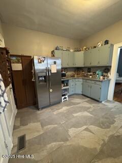 kitchen with stainless steel refrigerator with ice dispenser