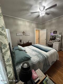 bedroom with hardwood / wood-style flooring and ceiling fan