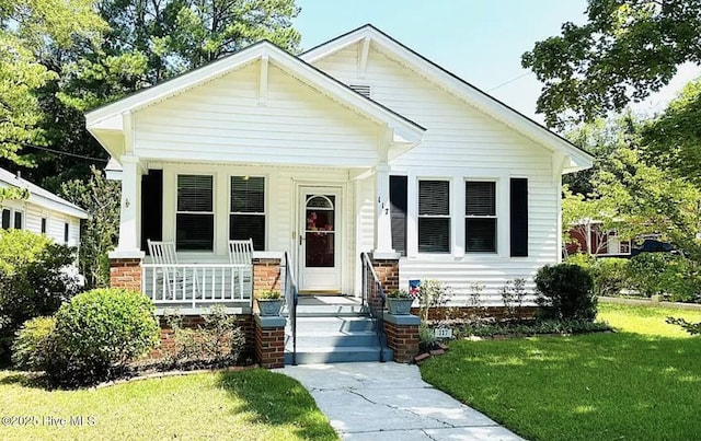 bungalow-style home featuring a front yard