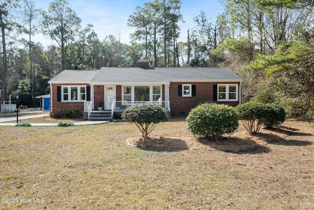 ranch-style home featuring a front yard