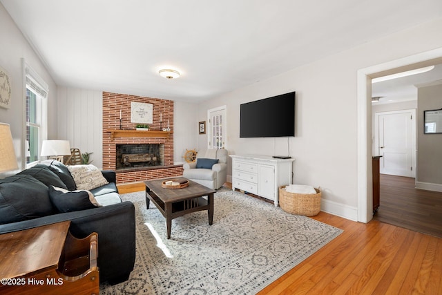 living room with a fireplace and light hardwood / wood-style floors