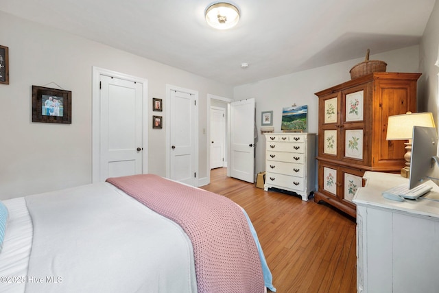 bedroom featuring light wood-type flooring