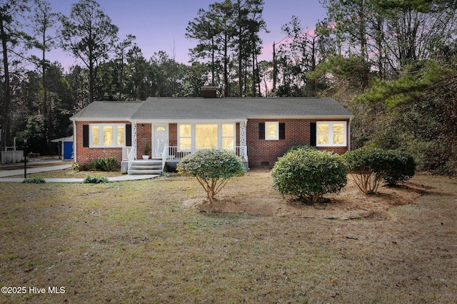 ranch-style house featuring a yard