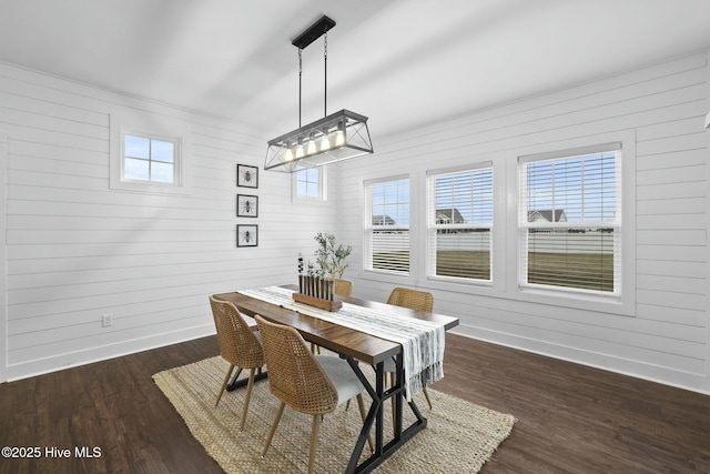 dining space with dark wood-type flooring