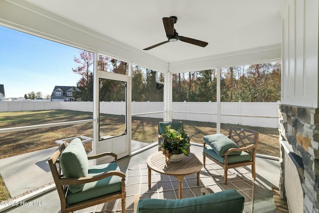 sunroom with plenty of natural light and ceiling fan