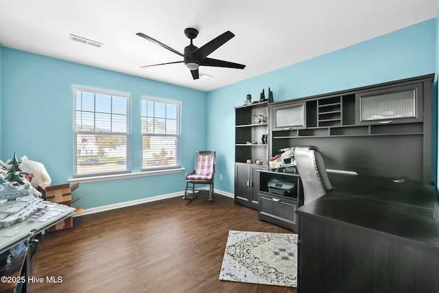 office area with dark wood-type flooring and ceiling fan