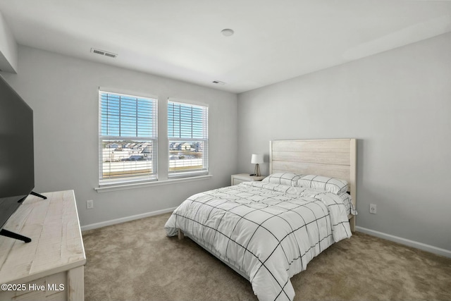 bedroom with light colored carpet