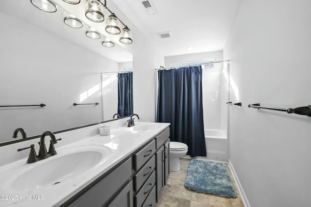 full bathroom with shower / tub combo with curtain, vanity, and toilet