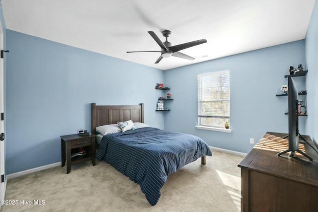 bedroom featuring light carpet and ceiling fan