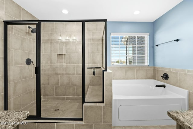 bathroom featuring vanity and plus walk in shower