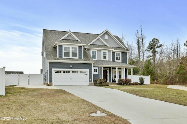 craftsman-style home featuring a porch, a garage, and a front yard