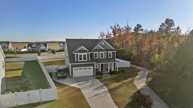 view of front of house with a garage and a front yard