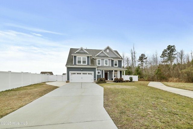 view of front of house featuring a garage, a porch, and a front yard