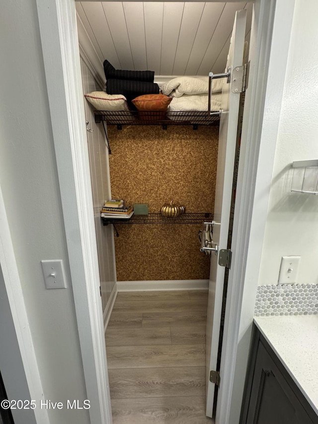 interior space featuring hardwood / wood-style flooring and vanity