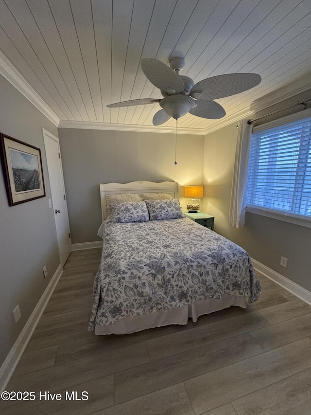 bedroom with wood ceiling, crown molding, ceiling fan, and hardwood / wood-style flooring