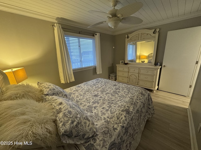 bedroom featuring hardwood / wood-style flooring, ceiling fan, ornamental molding, and wooden ceiling